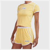 Yellow NB x Staud Terry Run Short | New Balance Clothing