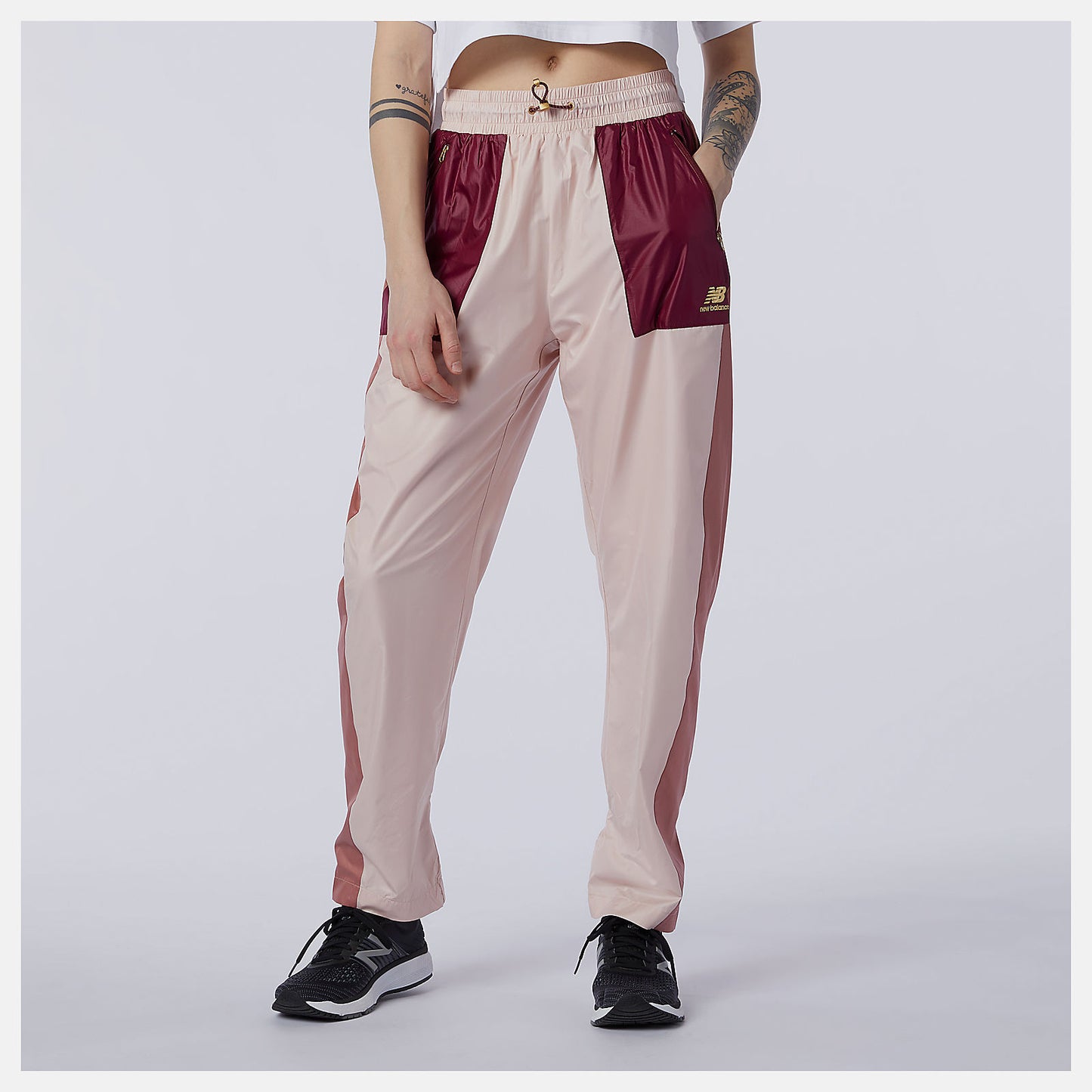 Oyster Pink NB Athletics Higher Learning Wind Pant | New Balance Clothing