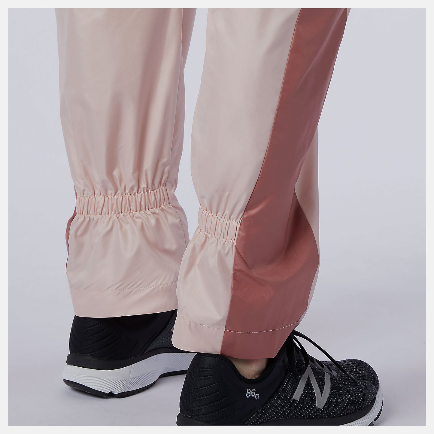Oyster Pink NB Athletics Higher Learning Wind Pant | New Balance Clothing